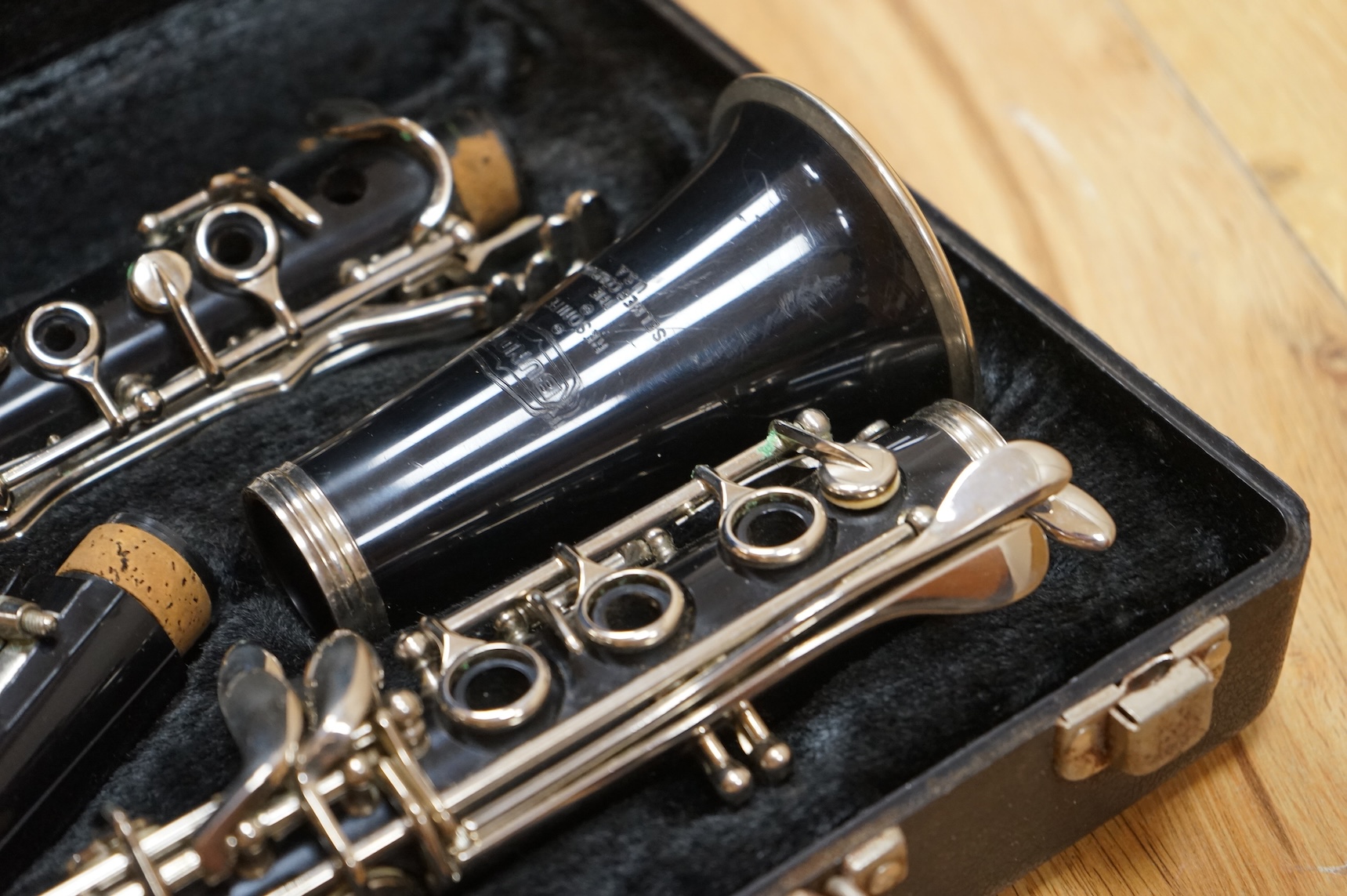 A cased Selmer plastic Bb clarinet.